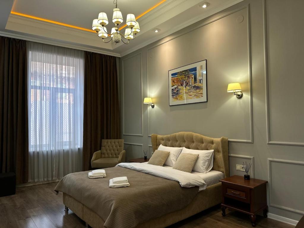 Ένα ή περισσότερα κρεβάτια σε δωμάτιο στο Premium Apartment on Kobylianska Street - City Center