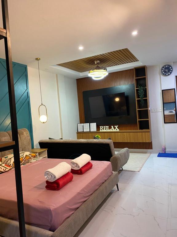 Ένα ή περισσότερα κρεβάτια σε δωμάτιο στο LacambraHills Olongapo Studio3