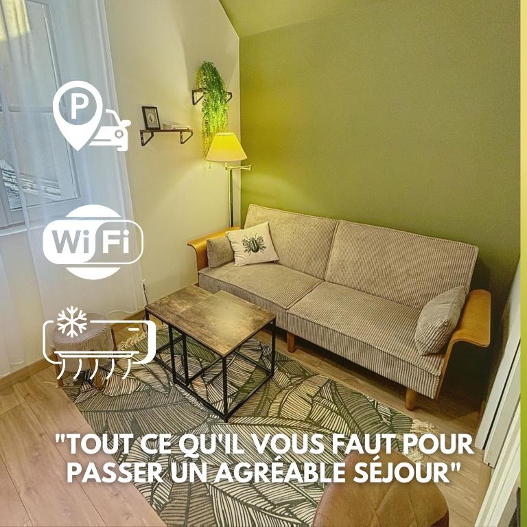 a living room with a couch and a table at Le Trinity tout confort avec parking privé au centre ville in Vendôme