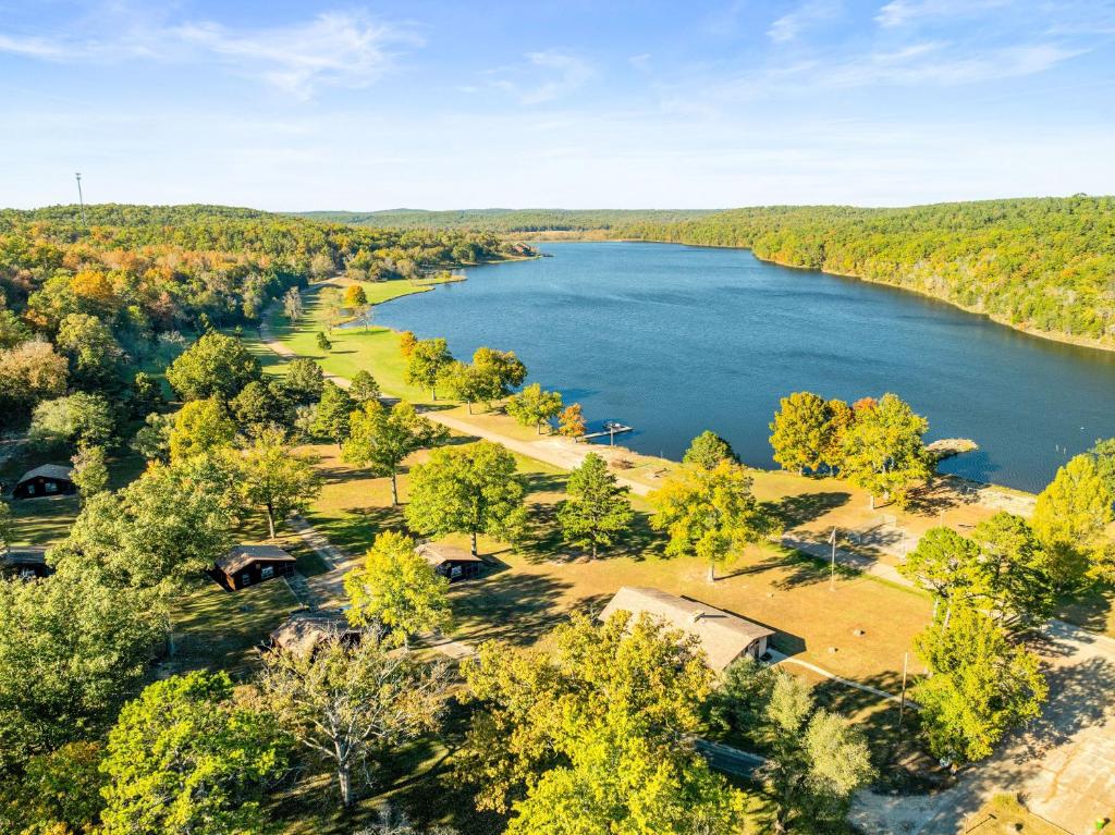 an aerial view of a lake in the woods at YMCA Trout Lodge in Potosi