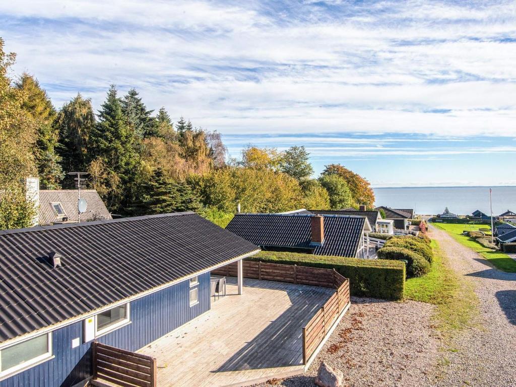 an aerial view of a house with a wooden deck at Seaside Haven with Spa - By Traum Ferienwohnungen in Sønder Bjert