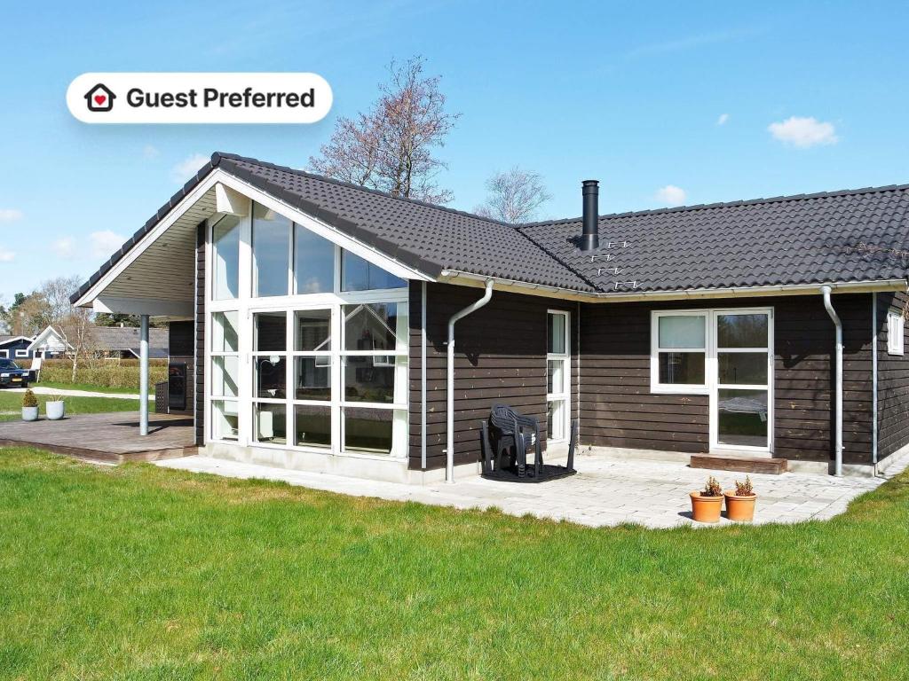 a small house with a screened in porch at 10 person holiday home in Hadsund-By Traum in Nørre Hurup