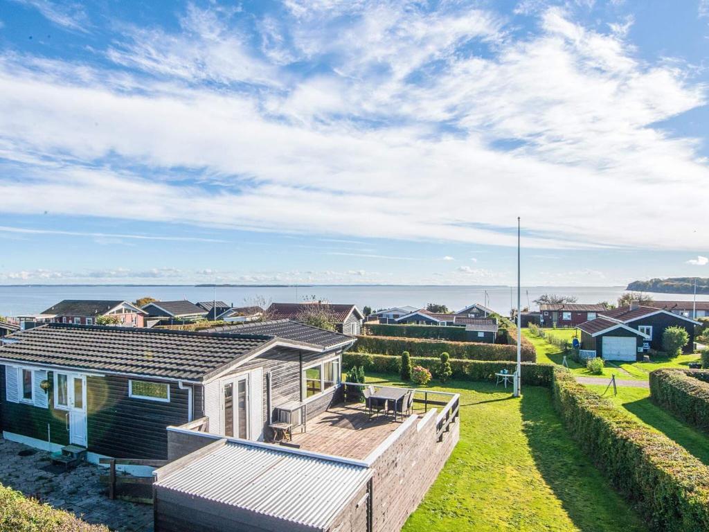 a holiday house with a view of the ocean at Panoramic Cottage Retreat-By Traum in Hejls