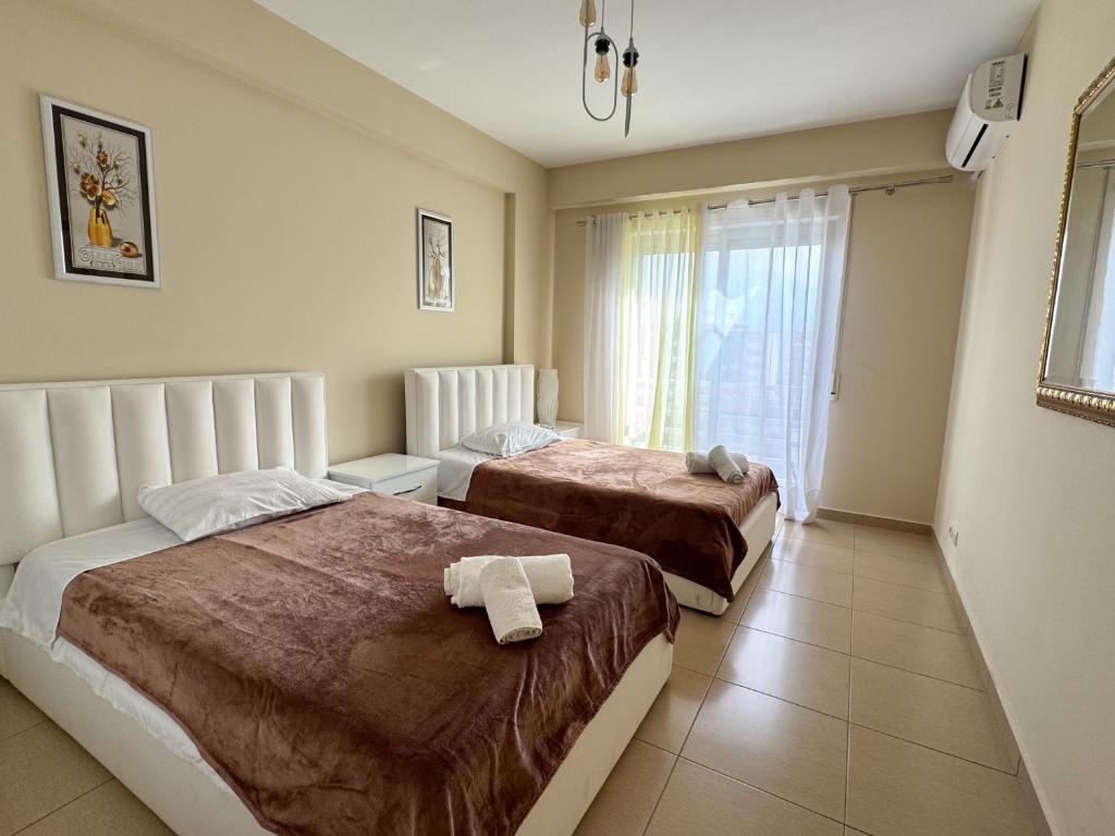 Postel nebo postele na pokoji v ubytování Shkodra Apartment