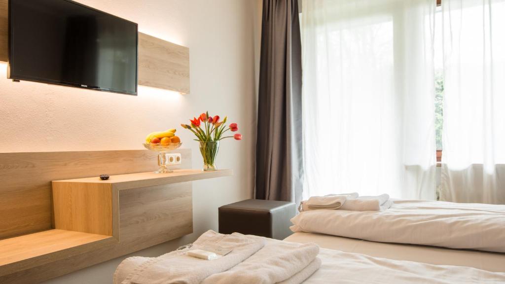 Postel nebo postele na pokoji v ubytování Ahorn Hotel