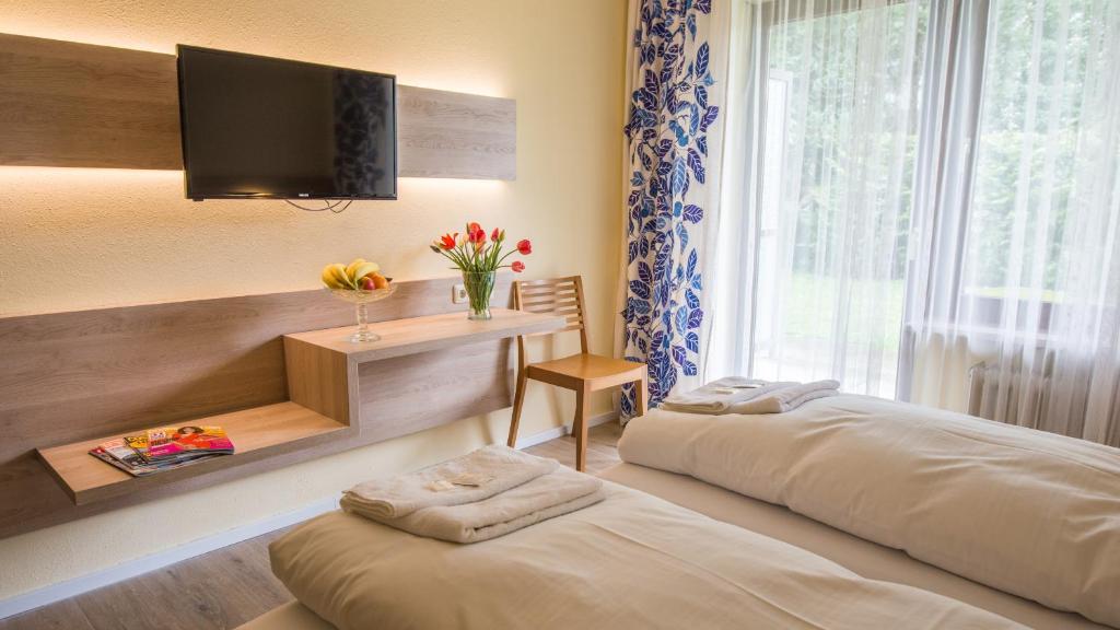 Postel nebo postele na pokoji v ubytování Ahorn Hotel
