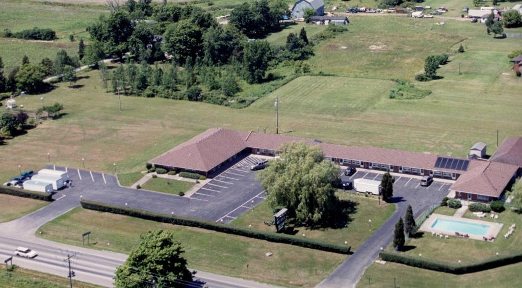 an aerial view of a large building with a pool at Port Motel in Port Colborne