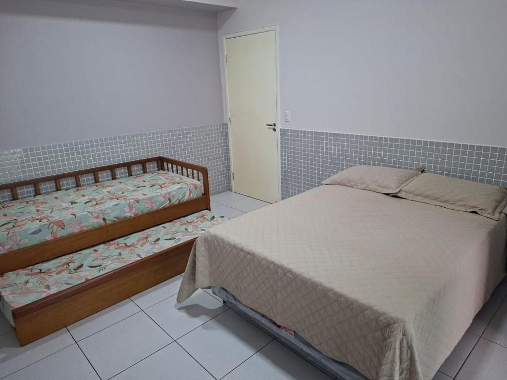 En eller flere senge i et værelse på Vila Forte do Mar