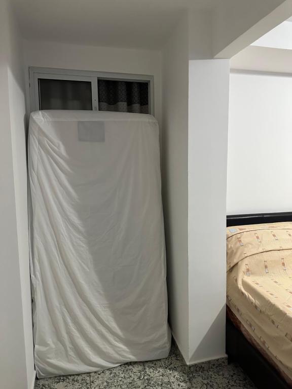 Ένα ή περισσότερα κρεβάτια σε δωμάτιο στο Momentos de Paz