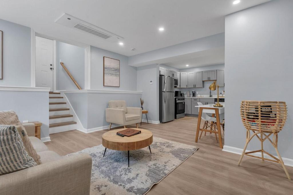 a living room with a couch and a table at The Boho Lux Haven Prov in Providence