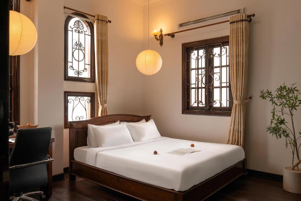 En eller flere senge i et værelse på Villa Paradise 6 Bedrooms