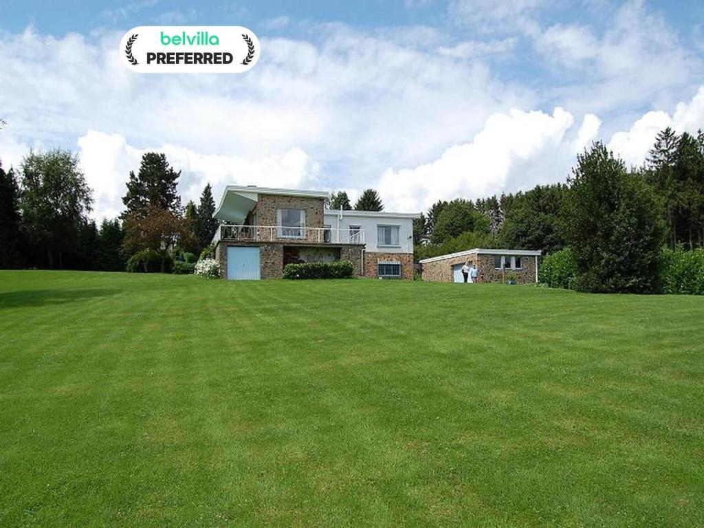 a house in a field with a large yard at Le Beau Souvenir, Noiseux in Noiseux