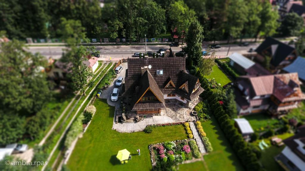 a model of a large house on a lawn at Willa Góralskie Spanie in Zakopane