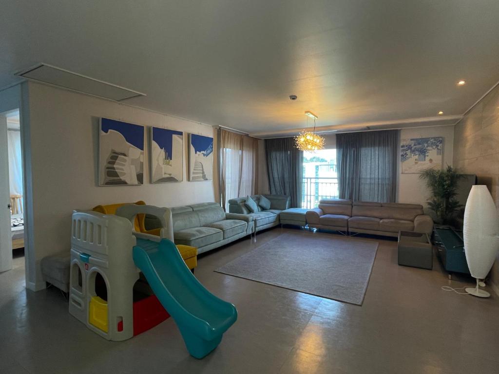 a living room with a childs bed and a slide at 뚠하우스3 in Samgong