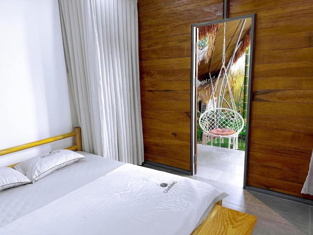 Postel nebo postele na pokoji v ubytování Cọ Homestay