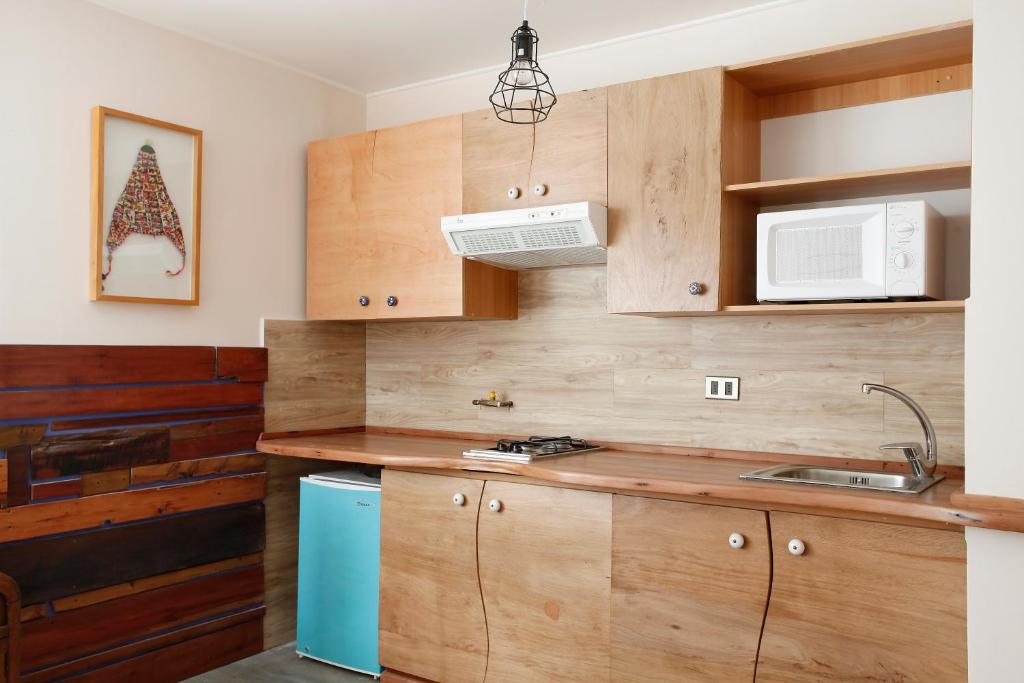 Kuchyň nebo kuchyňský kout v ubytování Apart Hotel Bianco