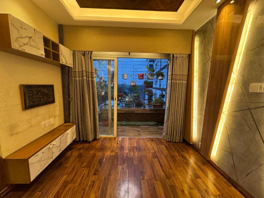 a room with a hallway with a door to a window at Modern Luxury Escape Balcony & Family Friendly in Dhaka