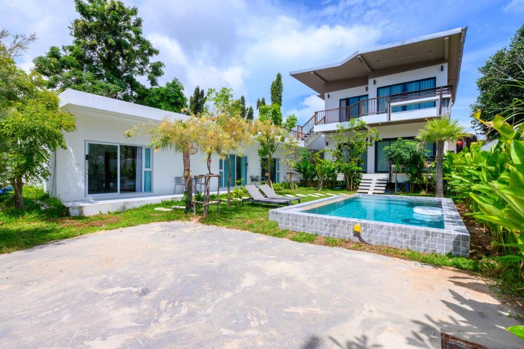 an image of a house with a swimming pool at Sunny Blue Runway in Ban Nai Na