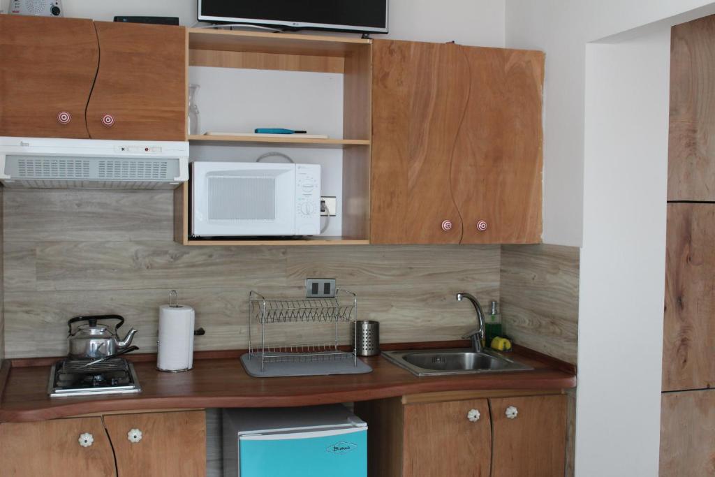 Kuchyň nebo kuchyňský kout v ubytování Apart Hotel Bianco