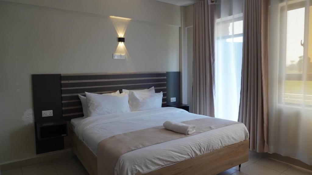 Postel nebo postele na pokoji v ubytování The Abode Naivasha