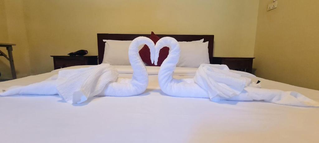 Ένα ή περισσότερα κρεβάτια σε δωμάτιο στο The Lodge kampot