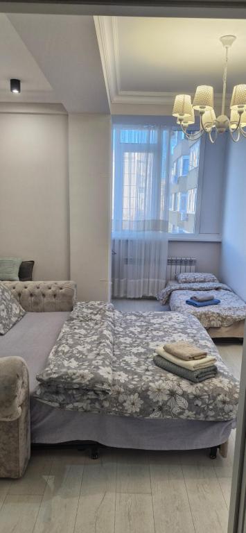 Ένα ή περισσότερα κρεβάτια σε δωμάτιο στο Air-Hotel Moldova