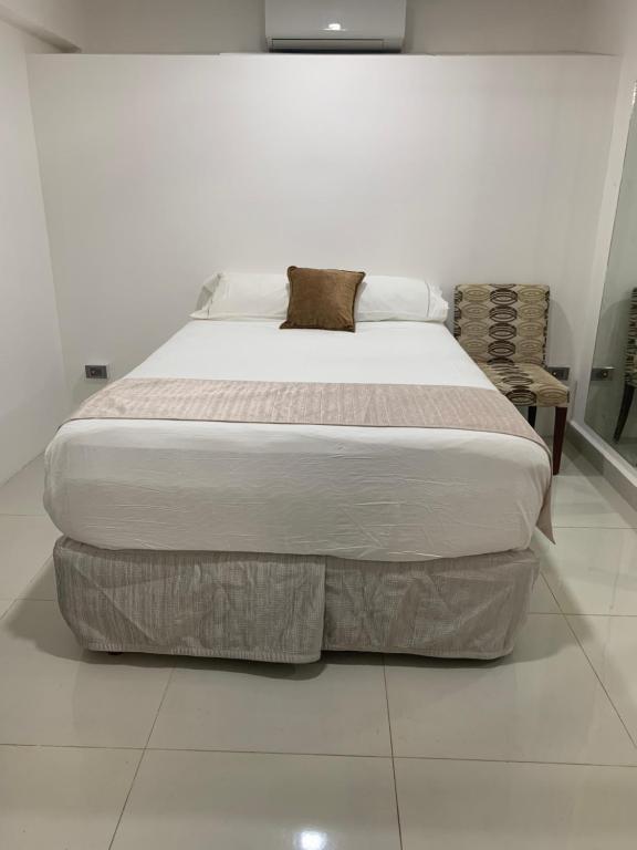 Ένα ή περισσότερα κρεβάτια σε δωμάτιο στο Villas Cozumel con alberca