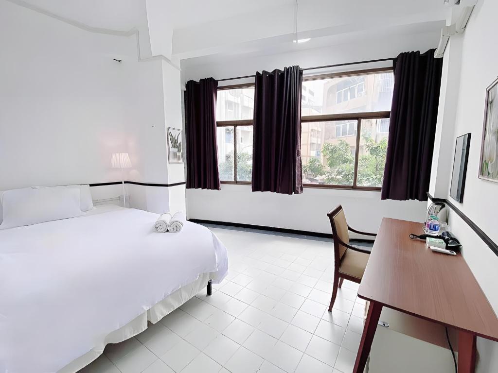 Ένα ή περισσότερα κρεβάτια σε δωμάτιο στο GO INN MRT Hua Lamphong โกอินน์ เยาวราช Mrt หัวลำโพง