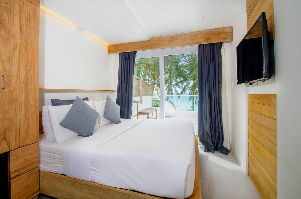 Postel nebo postele na pokoji v ubytování Zuzuni Boutique Hotel