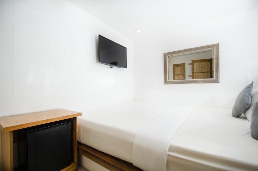 TV a/nebo společenská místnost v ubytování Zuzuni Boutique Hotel