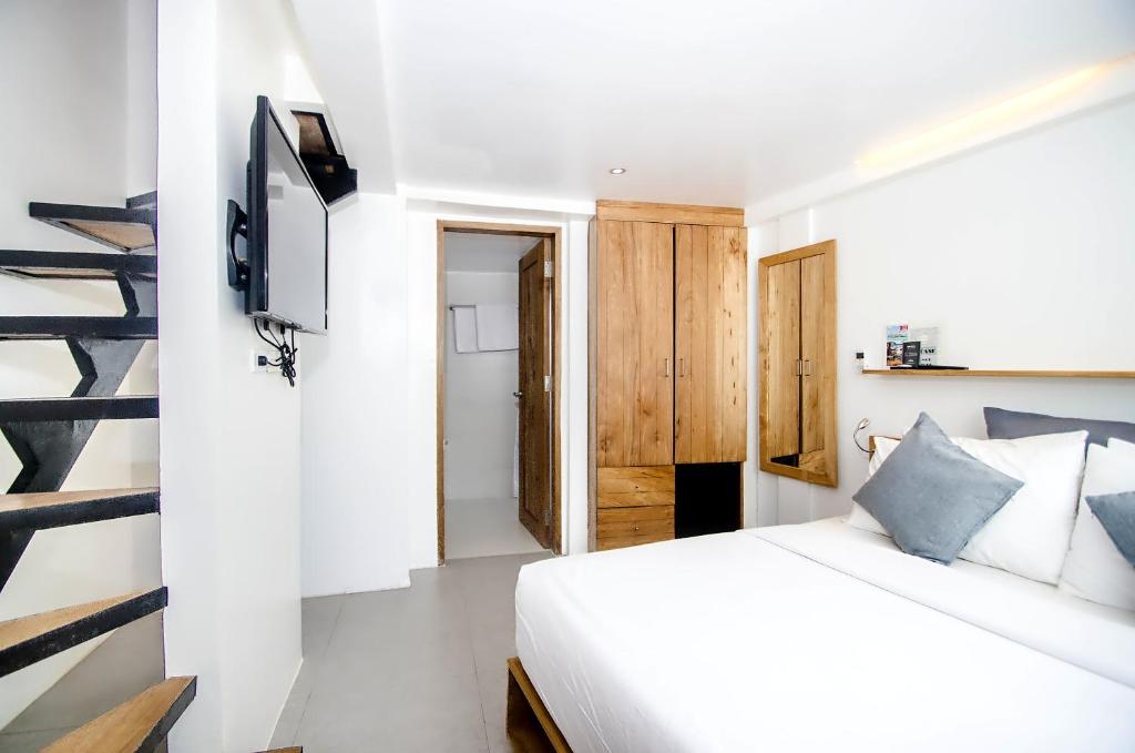 Postel nebo postele na pokoji v ubytování Zuzuni Boutique Hotel