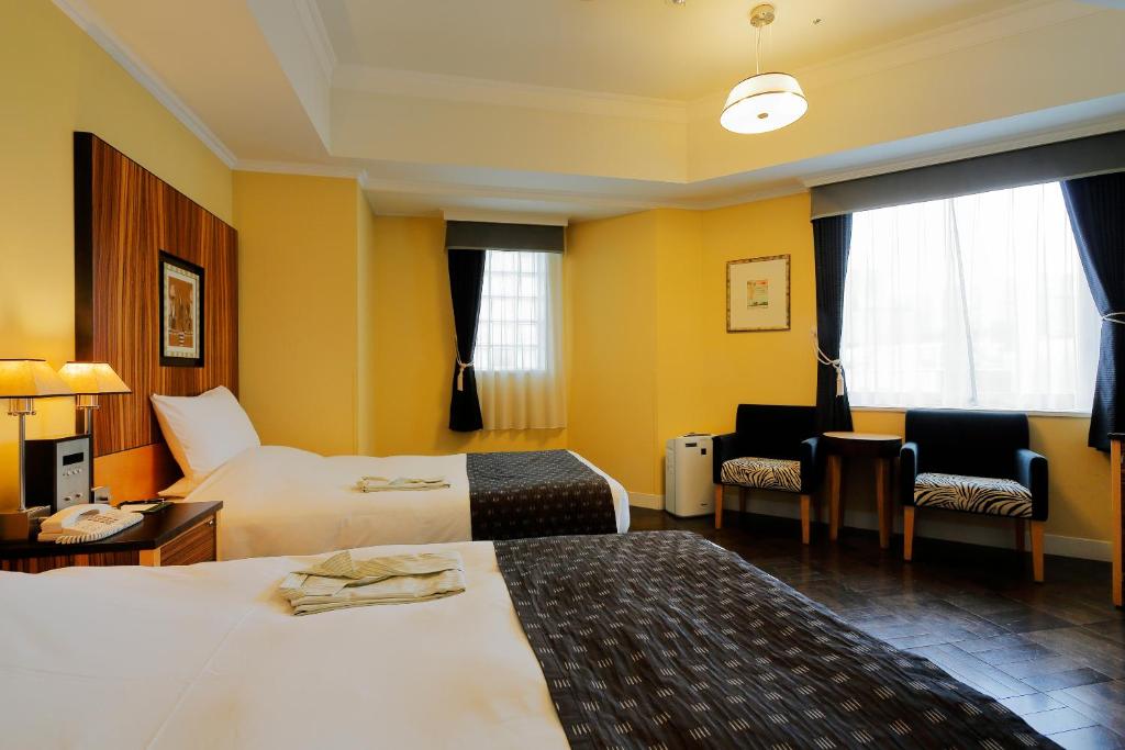 Cama ou camas em um quarto em Hotel Monterey La Soeur Fukuoka