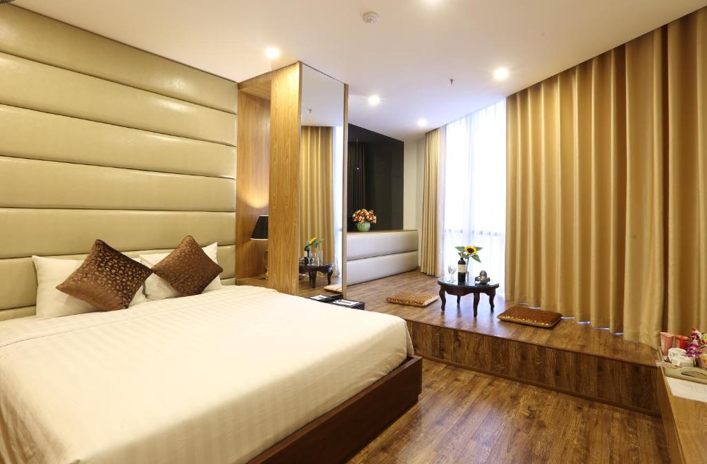 Postel nebo postele na pokoji v ubytování Au Viet Hotel