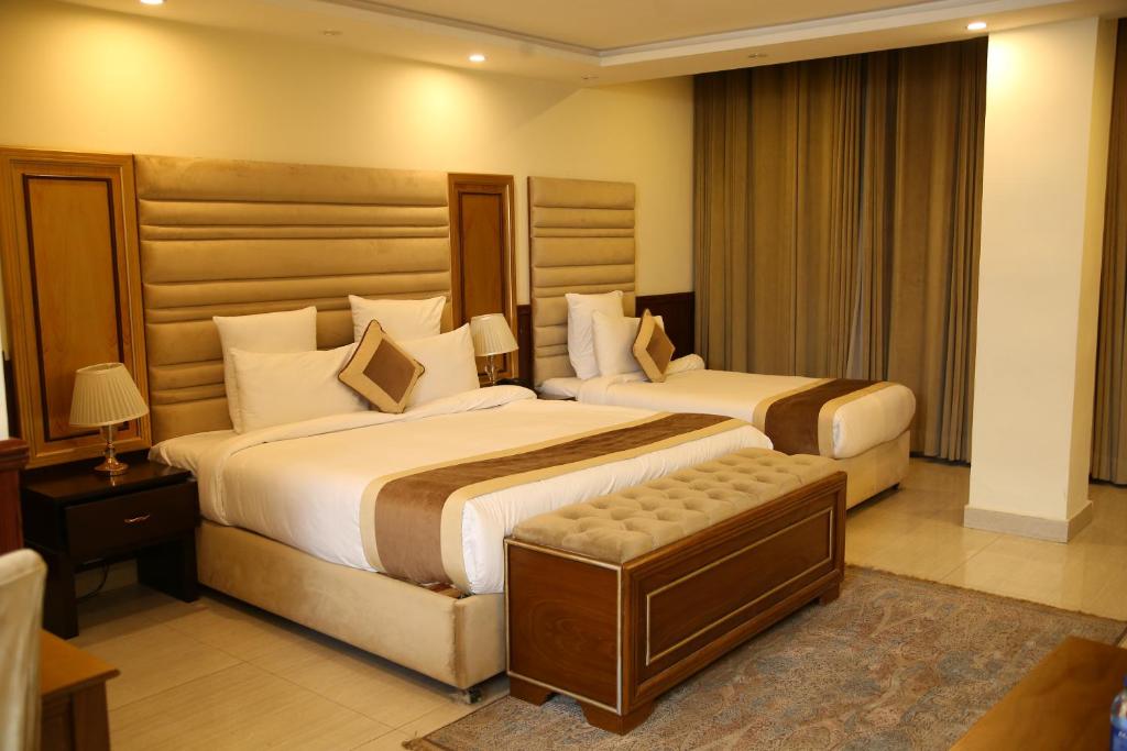 Ένα ή περισσότερα κρεβάτια σε δωμάτιο στο City Oasis Hotel