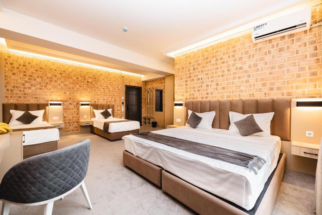 Ένα ή περισσότερα κρεβάτια σε δωμάτιο στο Air Hotel