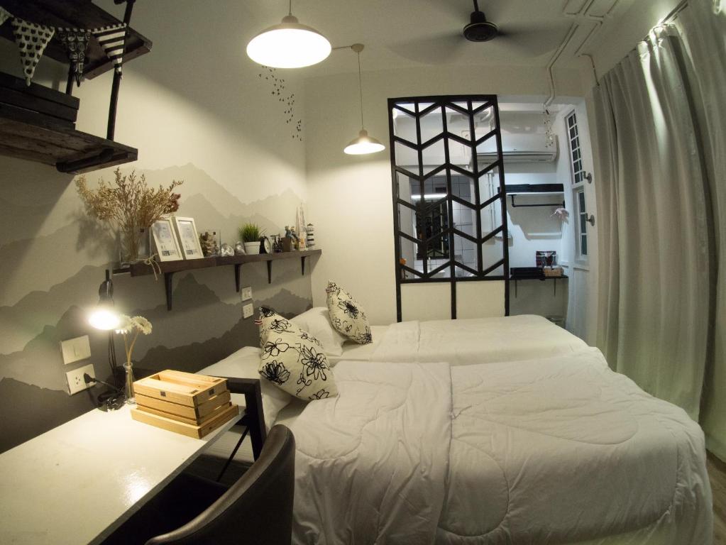 Postel nebo postele na pokoji v ubytování Jetty Huahin Hostel