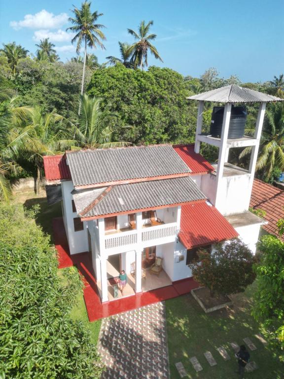 an overhead view of a house with a red roof at Viska Villa 2 Bedroom Home 5 min to Hiriketiya in Nilwella