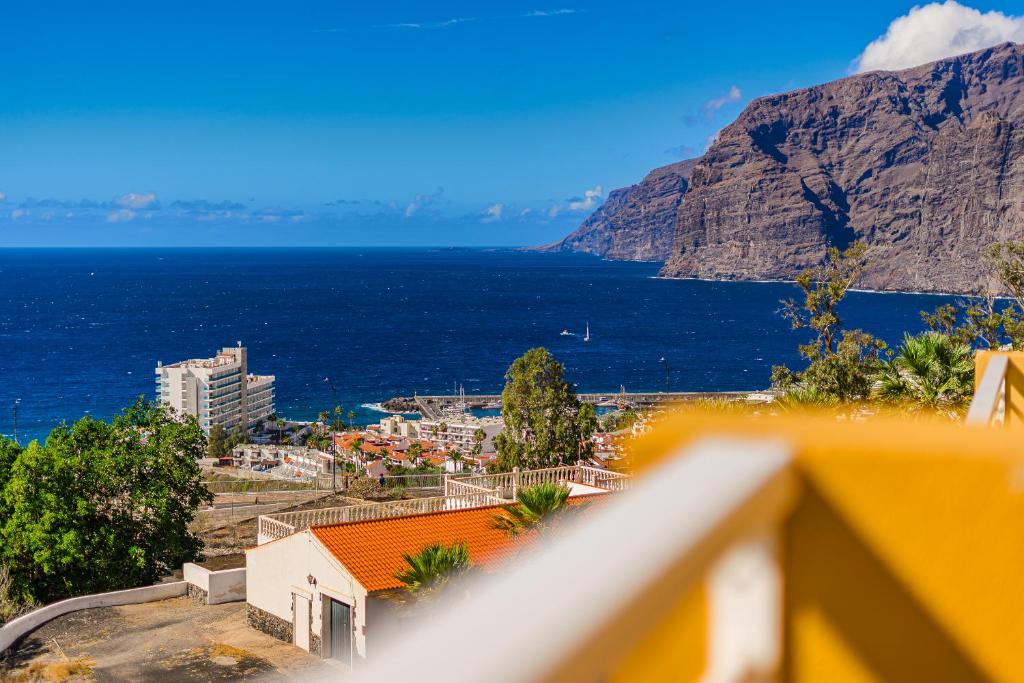 a view of the ocean from a balcony at Eva The View in Puerto de Santiago