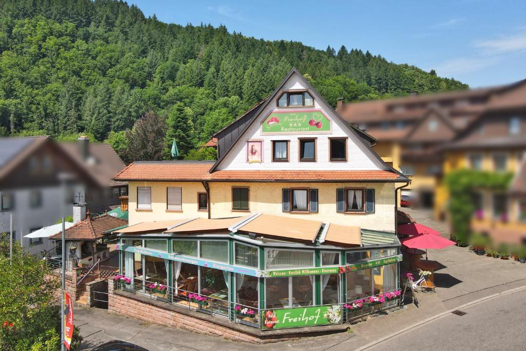 a large building with a restaurant on the street at Hotel Restaurant Freihof in Oberharmersbach
