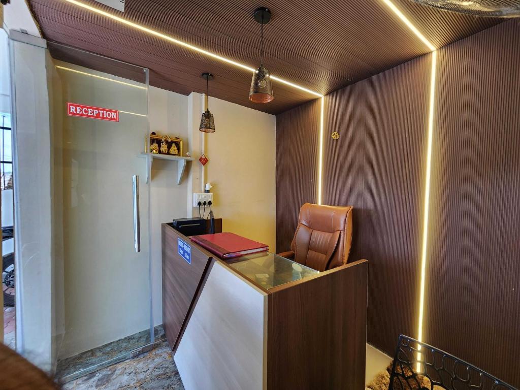 an office with a desk and a chair in a room at Hotel O SSR residency in Chennai