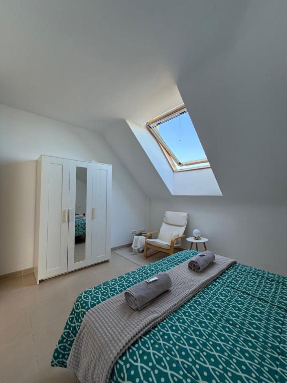 Postel nebo postele na pokoji v ubytování La Buhardilla