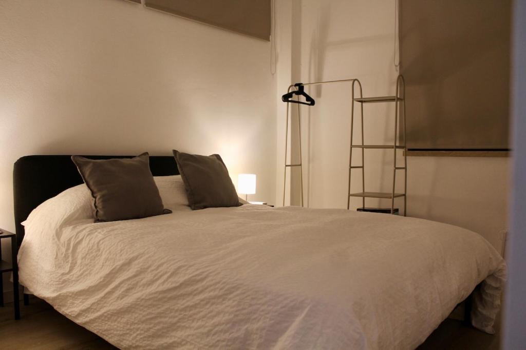 Postel nebo postele na pokoji v ubytování Domingos House