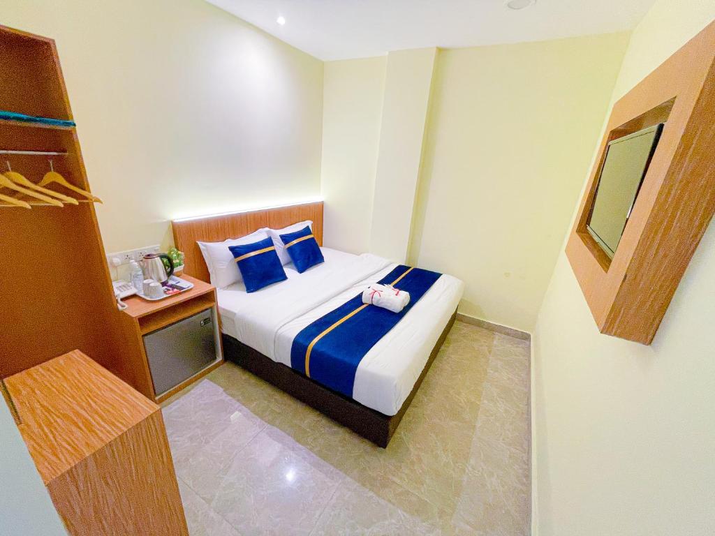 Ένα ή περισσότερα κρεβάτια σε δωμάτιο στο Astar Hotel