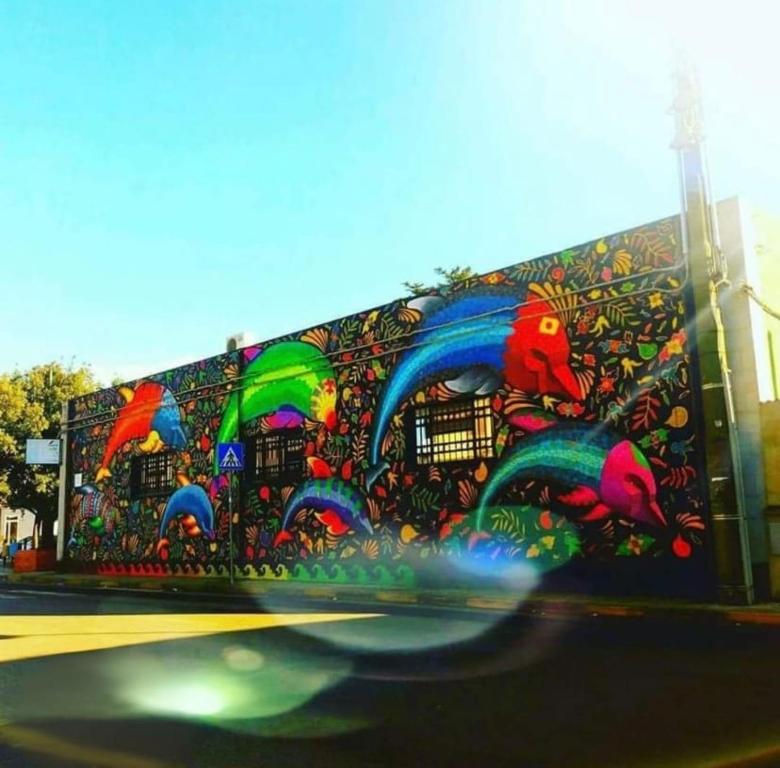 a wall with a painting ofbows on it at Casa Amore Design - South Sardinia - in San Gavino Monreale