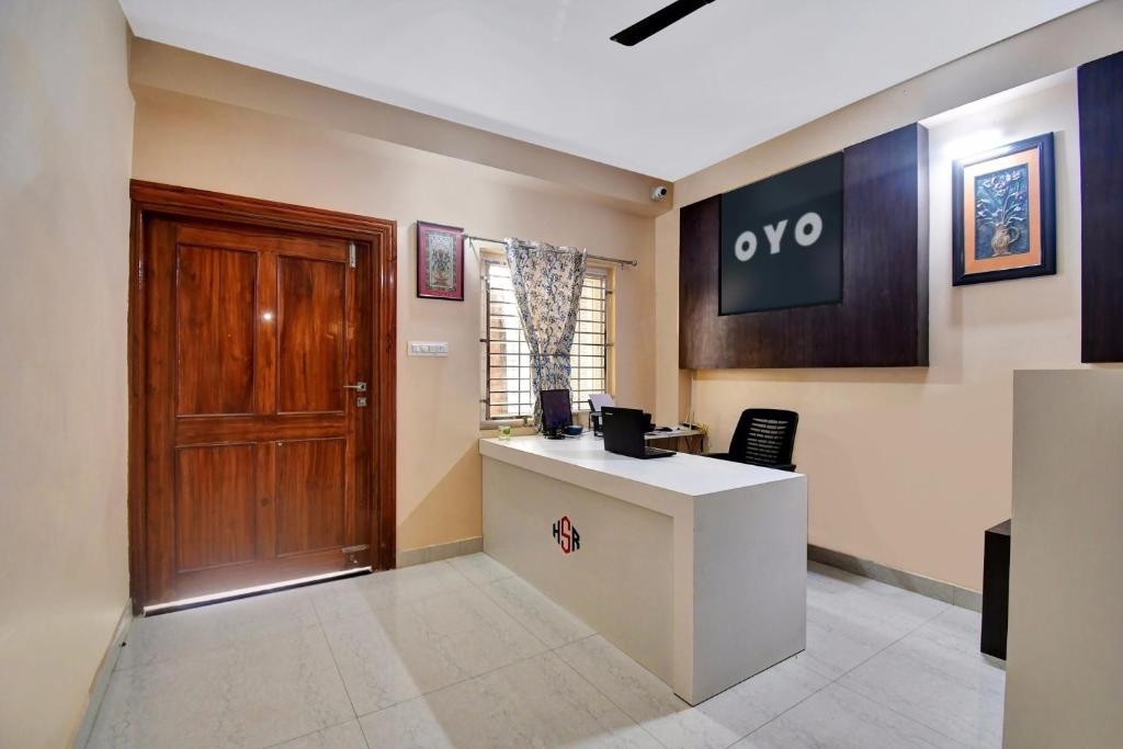 a office with a desk and a door in a room at Hotel O Relax Inn in Jānla