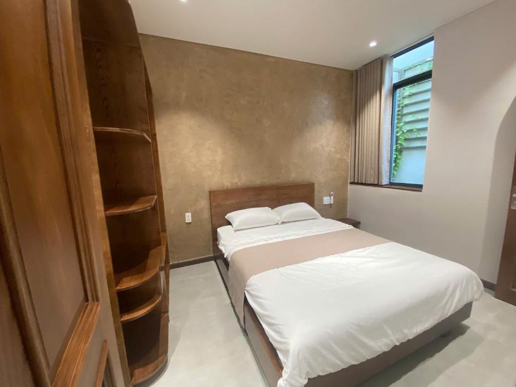 Postel nebo postele na pokoji v ubytování Nhà Gối Homestay - Chạm Bình Yên