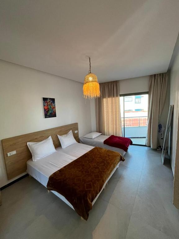 Ένα ή περισσότερα κρεβάτια σε δωμάτιο στο Atlantic view Tamraght 2