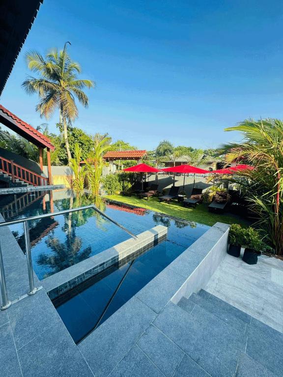an image of a swimming pool in a resort at Lucky Monkey Inn and Restaurant in Weligama