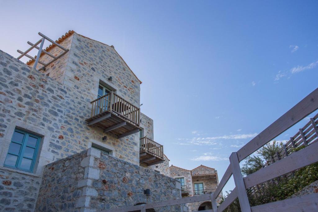 a building with balconies on the side of it at Thirides Beach Resort in Gythio