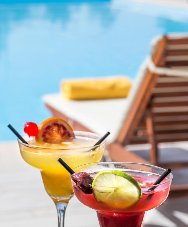 two cocktails sitting on top of a table at Thirides Beach Resort in Gythio